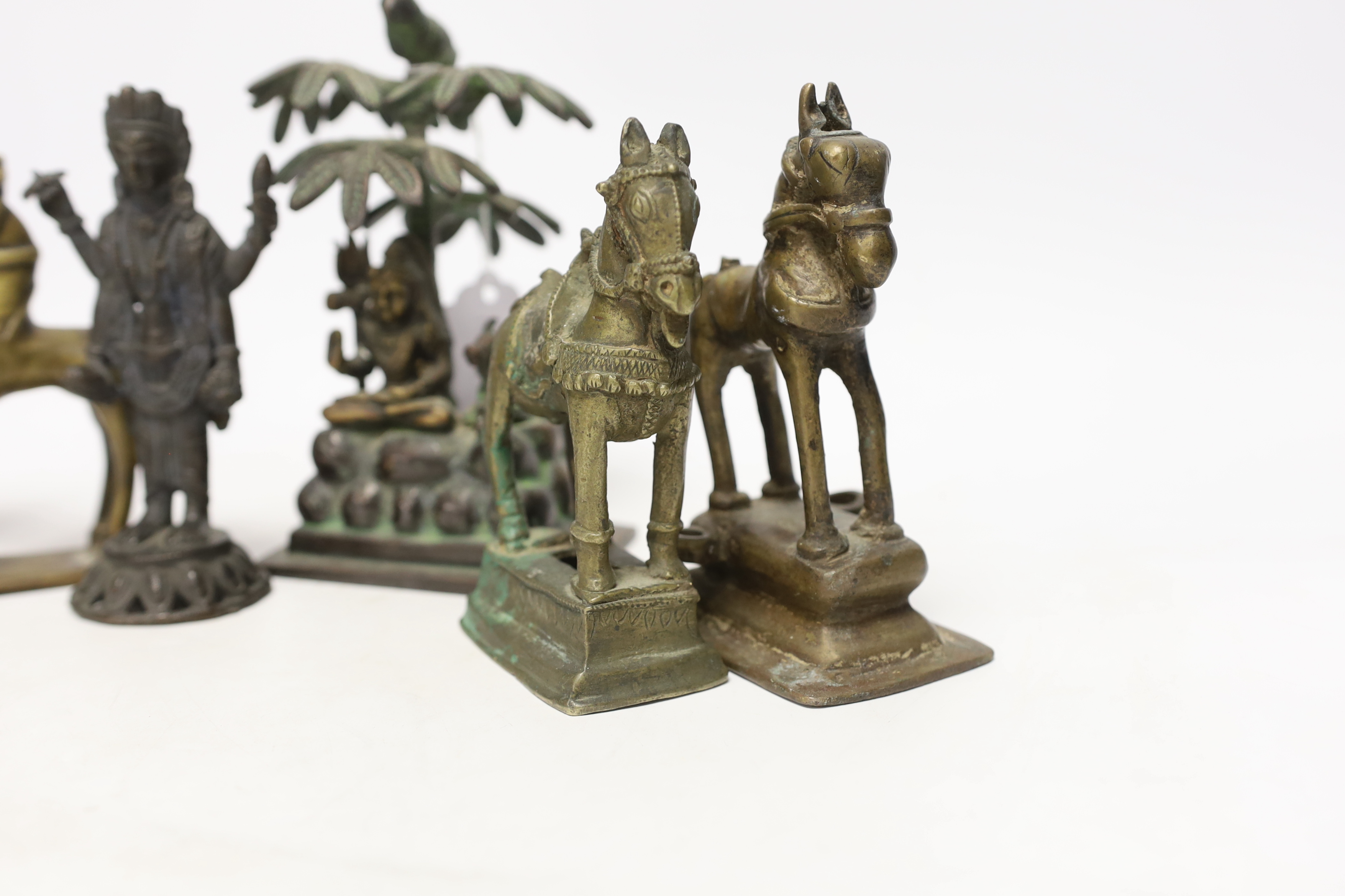 Six Indian bronze/brass ornaments; Shiva sitting under a bael tree with a bird, 17cm, two figures of Lord Vishnu and three horses